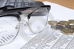 Close up of a pair of spectacles on an account's desk