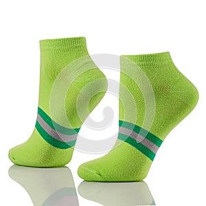 Close up of pair of sports cotton socks on invisible legs isolated on white background.