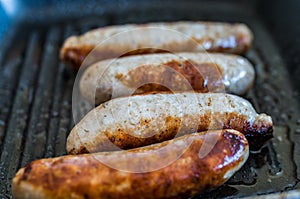 Close up of pan fried sausages