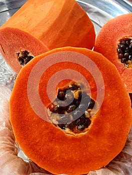 A close up of a papaya cut in half. beautiful picture of red Papaya.