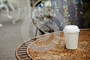 Close up paper cup on the rust table
