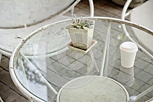 Close up paper cup on the rusty table