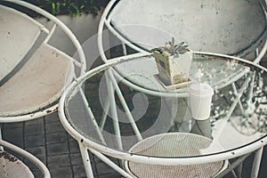 Close up paper cup on the rusty table