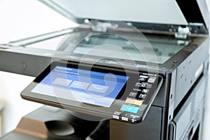 Close up paper sheets on the printer in office room