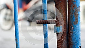 Close up part of the blue iron gate