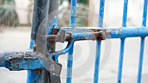 Close up part of the blue iron gate