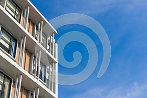 Close up part of condominium modern style on blue sky background