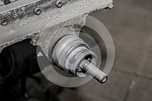 Close-up of part of an old milling machine tool and metal processing equipment in the workshop of an industrial plant