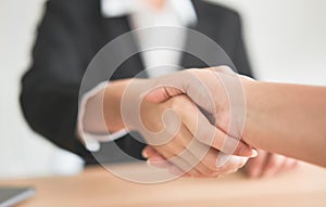 Close up of partnership handshake successful after negotiating business. Connection deal concept.