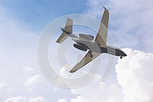 Close-up of a passenger plane flying against a blue sky