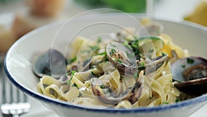 Close up of pasta with mussels and creamy garlic sauce
