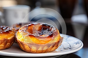 Close up of Pastel de Nata or pastel de BelÃÂ©m, a Portuguese egg custard tart pastry photo