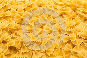 Pattern made of raw farfalle pasta