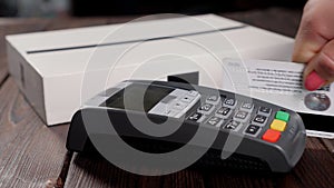 Close-up of paying an invoice or a purchase with a credit card.