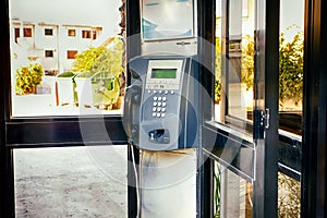 Close-up of payphone in the street