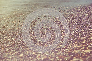 Close up of a pebble beach with the sea.