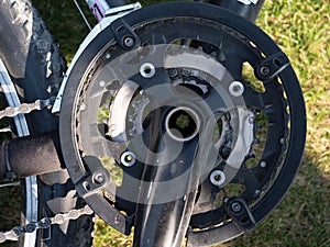 Close up of pedal system at a mountain bike with chain crankset