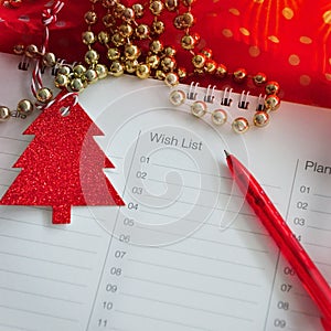 Close up Pen Point to Wish List in Christmas Concept