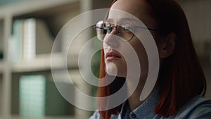 Close up pensive Caucasian business woman looking away thinking smiling thoughtful girl businesswoman in glasses think