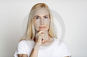 Close up of pensive middle aged woman