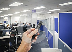 people hand hold wireless presentation pointer in office for meeting and conference photo