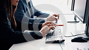 Close up people hands typing on laptop keyboard