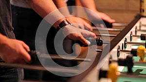 Close-Up of People Playing Foosball