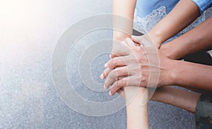 Close up of people putting their hands together. Stack of hands