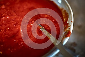 Close up of peppers being crushed in a mortar