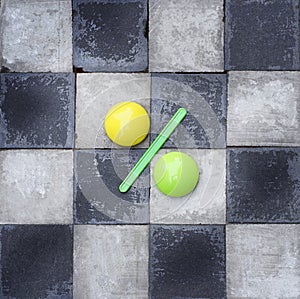 Close-up Of A Percentage Sign Leaning On black and white chess background