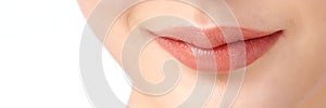 Close-up perfect natural lip makeup beautiful female mouth. Plump sexy full lips. on white background, Perfect clean skin, fresh