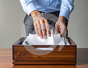 Person Casting Vote in Ballot Box for Election Process