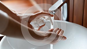 Close up of person cleanse hands with antibacterial soap photo