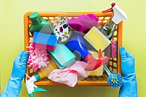 close up person holding basket with cleaning products. High quality photo