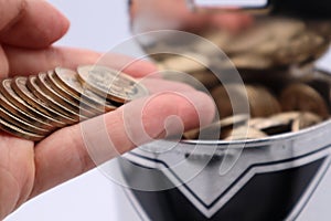 Close-up of a person holding a 500 yen coin