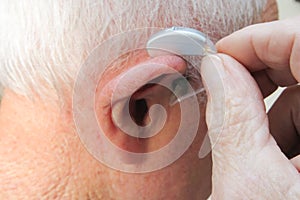 Of A Person Putting Hearing Aid Old Man senior Ear