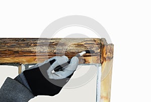 Close up of a person restoring sash windows