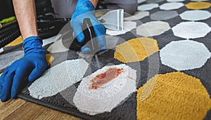 Close-up Of Person`s Hand Cleaning Stain On Carpet With Sponge.