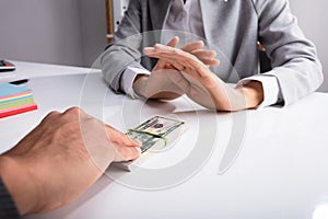 Close-up Of A Person`s Hand Refusing Bribe