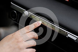 Close-up Of A Person& x27;s Hand Using Gps Navigation System In Car. Woman using navigation system while driving a car