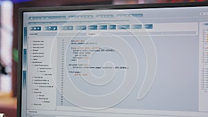 Close up of person using coding application to write and test code