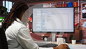 Close up of person using coding application to write and test code