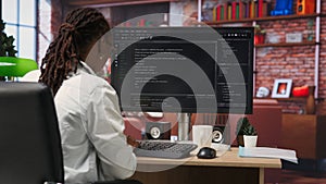 Close up of person using coding application to write and test code