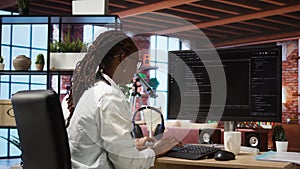 Close up of person using coding application to write and test code