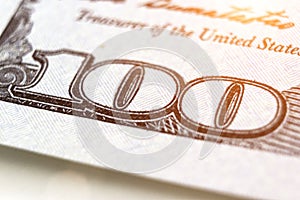 Close up perspective view of hundred-dollar bill. Dolar USA close up. Number 100 on 100 dollar bill with sunlight