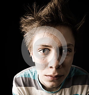 Close-up of perspiring tense teen