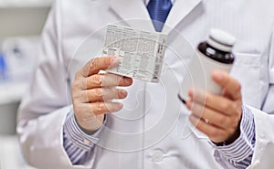 Close up of pharmacist with medicine at pharmacy