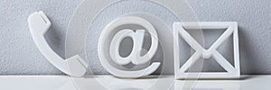 Close-up Of A Phone, Email And Post Icons. Contact Us