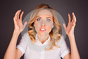 Close up photo of aggressive young woman showing her hands