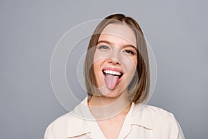 Close up photo amazing crazy she her lady playful funny facial expression tongue out mouth toothy impolite childish